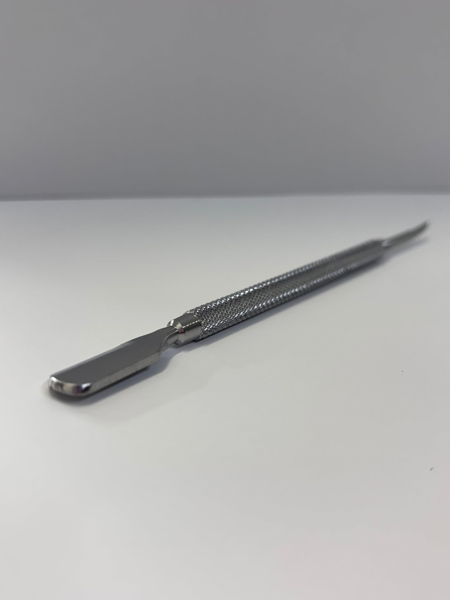 Pusher and nail cleaner